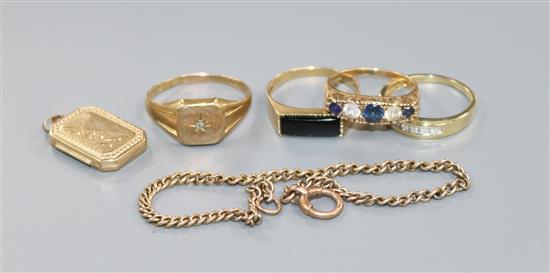 Four assorted 9ct gold and gem set rings, a 9ct gold locket and a 9ct small bracelet.